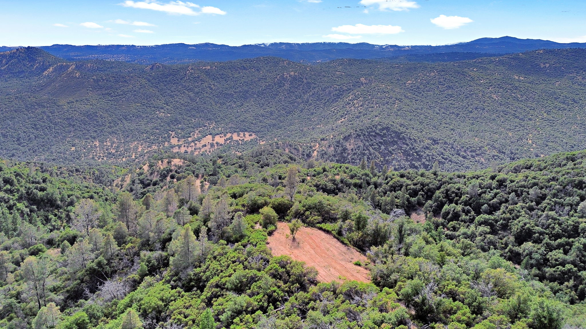 Sweeping aerial of the ranch property